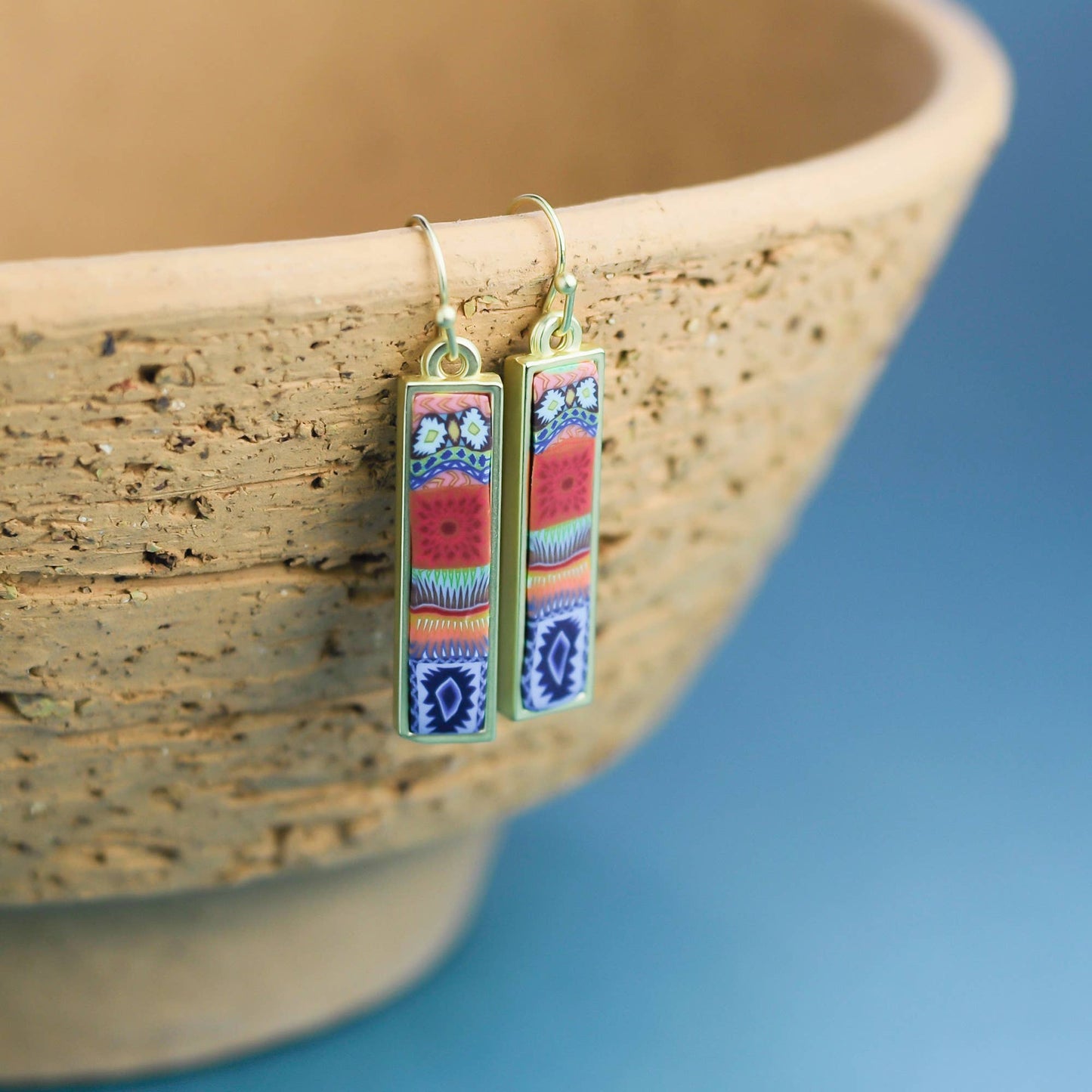 Sedona Sky is a bright and bold color collection that elevates and inspires. This reversible style features a vibrant and colorful pattern mix on the front side with softer and soothing turquoise blues on the other to create distinct and complementary looks.